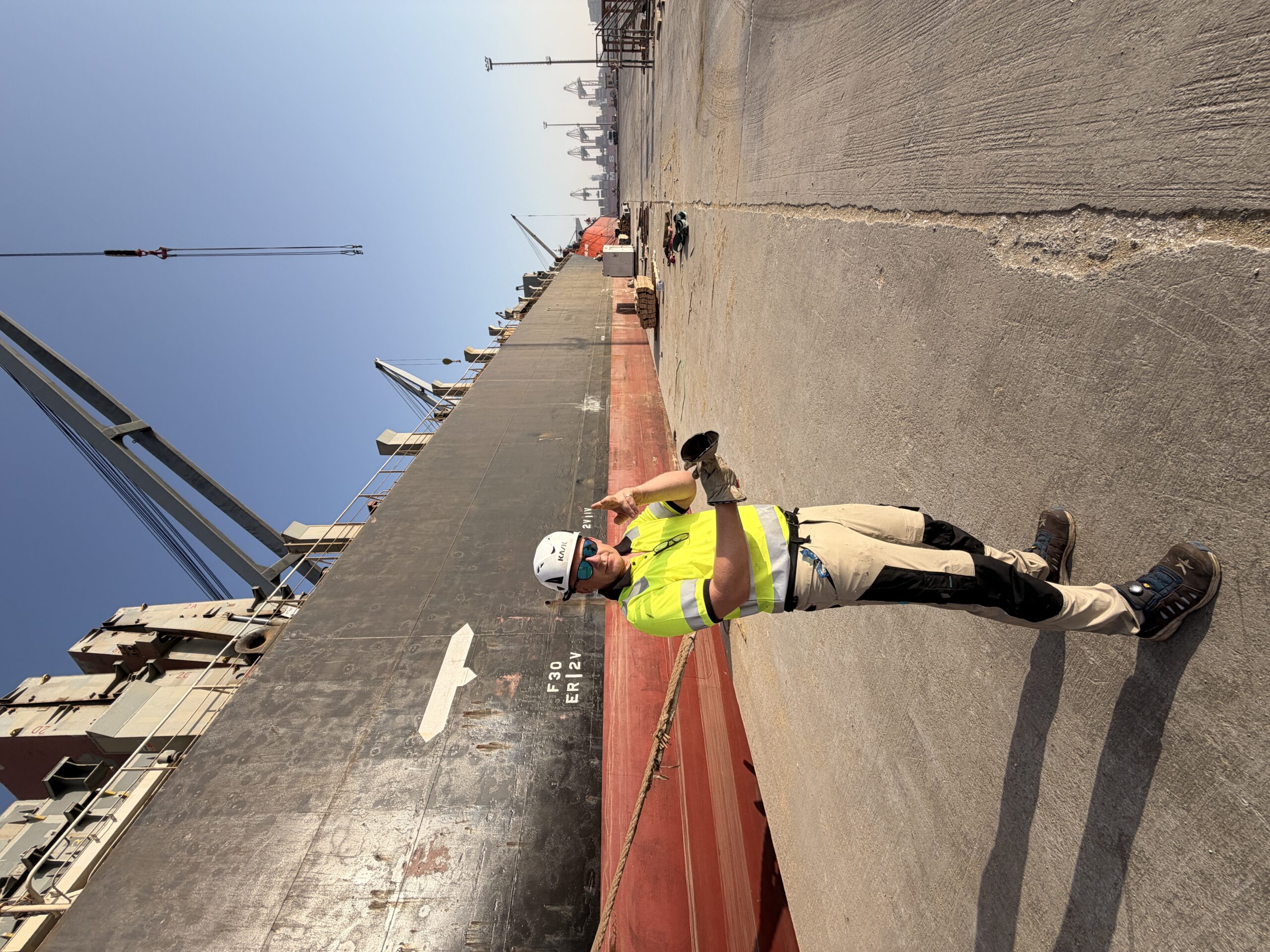 AK Marine port captain in full PPE on the quay alongside M/V Thorco Liva